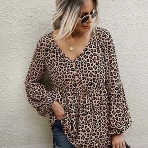 Leopard print, ruffle trim blouse.